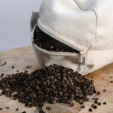 Gaiši zaļš mīkstināta lina vidējais griķu spilvens - rullītis - pagalvītis