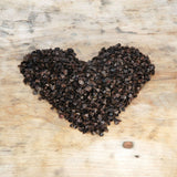 Gaiši zaļš mīkstināta lina vidējais griķu spilvens - rullītis - pagalvītis