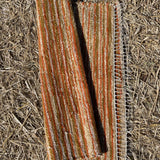 Oranžas, bēšas, sinepju toņa svītriņas, vilnas auduma grīdceliņš ~70x100cm