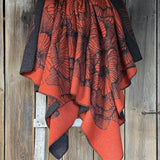 Oranža/melna toņa aitas vilnas sega ar ziedu rakstu